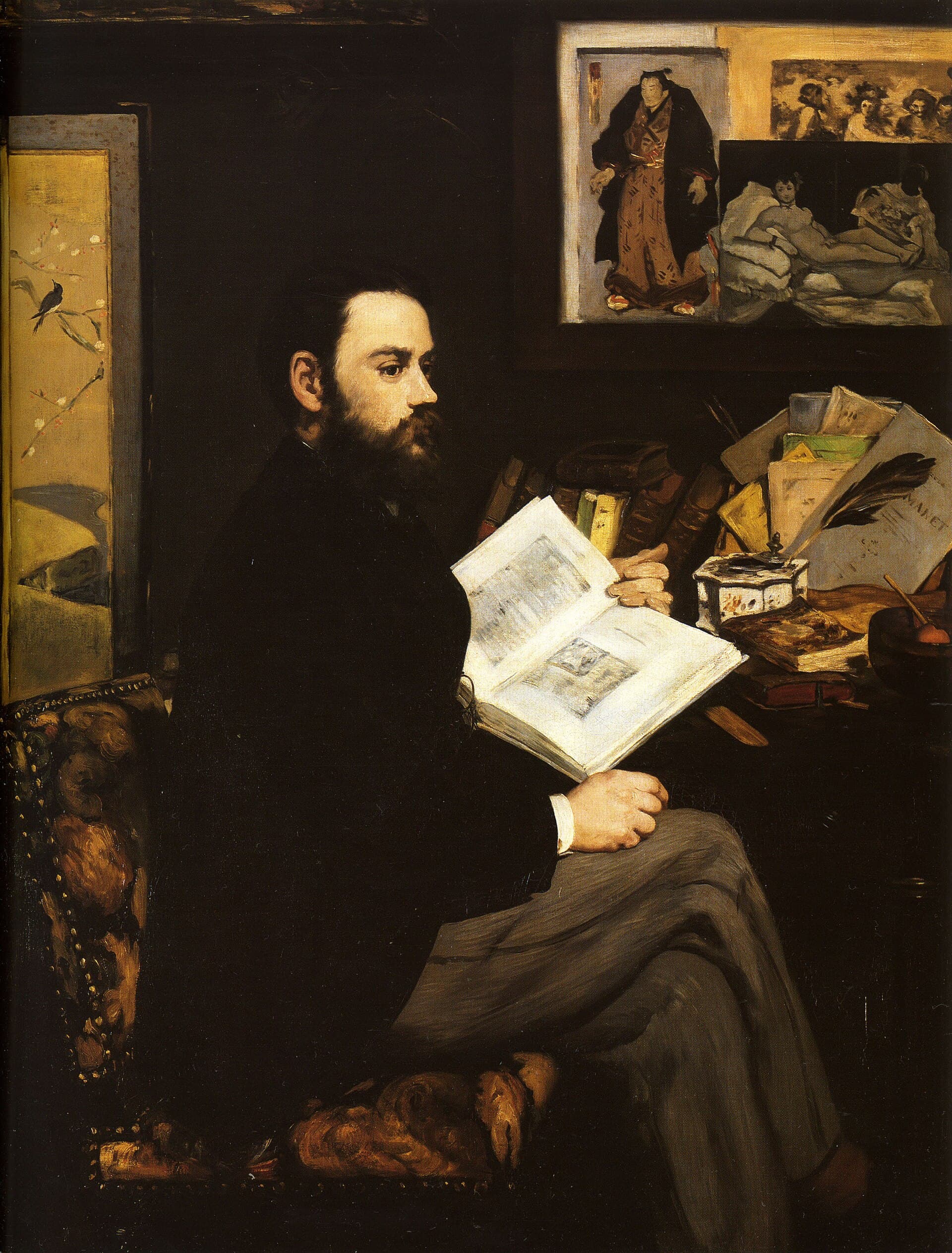 The novelist Émile Zola seated at his desk surrounded by books and prints, a reproduction of Olympia pinned to the wall.